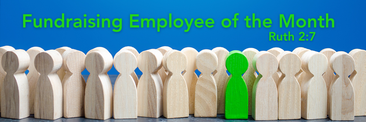 Image of a group of light wooden figurines standing in rows, with one bright green figurine standing out in the center. Above the group is the title "Fundraising Employee of the Month" in bold green and blue text, with the Bible reference "Ruth 2:7" in smaller text.