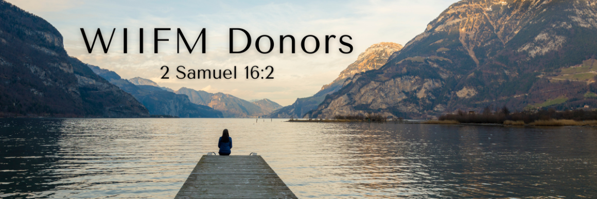Person sitting alone at the end of a dock overlooking a calm lake surrounded by mountains at sunset, with the words “WIIFM Donors” and a Bible reference displayed in the sky above.