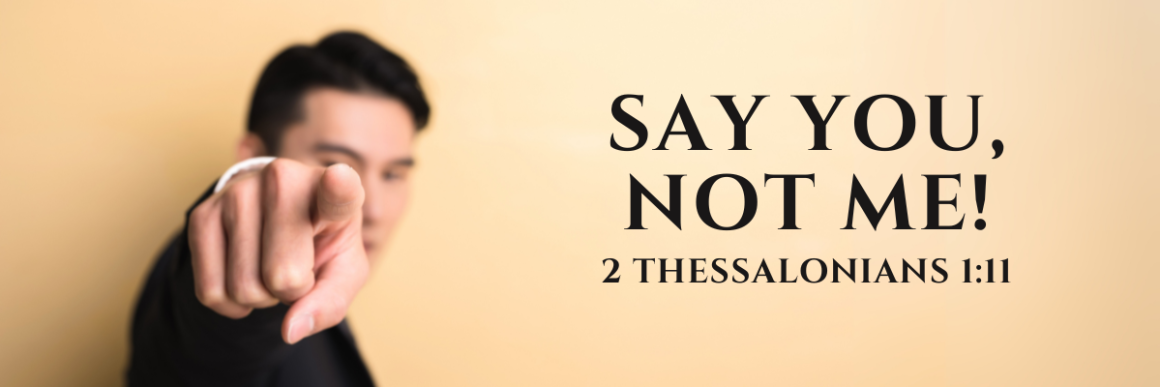 A man in a suit pointing directly at the camera with a serious expression, set against a soft beige background; bold text on the right reads “SAY YOU, NOT ME! 2 Thessalonians 1:11.