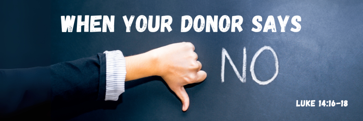 A person’s hand giving a thumbs-down gesture in front of a dark chalkboard background with large white text that reads “When Your Donor Says No” and a smaller Bible reference “Luke 14:16–18.”