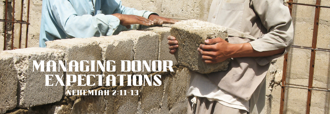 Two workers building a stone wall, each holding large concrete blocks, with the title Managing Donor Expectations overlaid on the image.