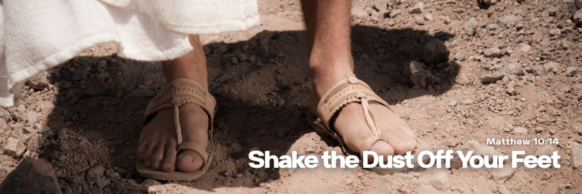 Close-up of two people wearing sandals walking on a dry, dusty path with the title Shake the Dust Off Your Feet displayed at the bottom.