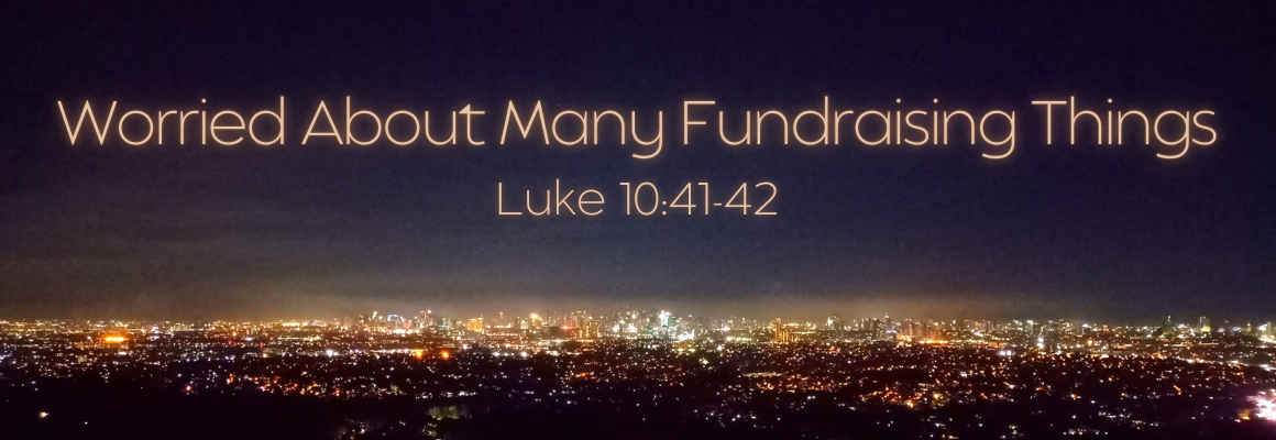 quotation marks Nighttime city skyline with glowing lights stretching across the horizon, overlaid with the text Worried About Many Fundraising Things and a scripture reference, conveying busyness and overwhelm in fundraising.