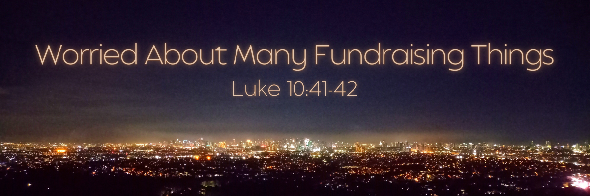 quotation marks Nighttime city skyline with glowing lights stretching across the horizon, overlaid with the text Worried About Many Fundraising Things and a scripture reference, conveying busyness and overwhelm in fundraising.
