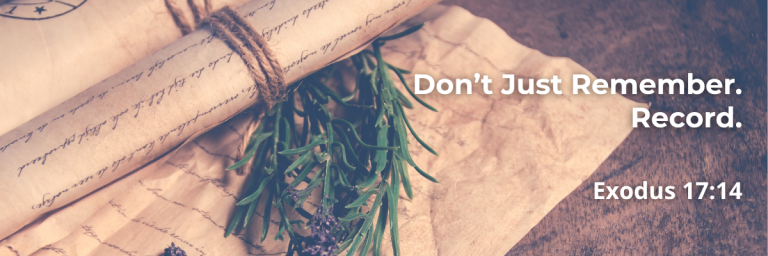 Scroll tied with twine beside rosemary and lavender, with text 'Don't Just Remember. Record. Exodus 17:14'